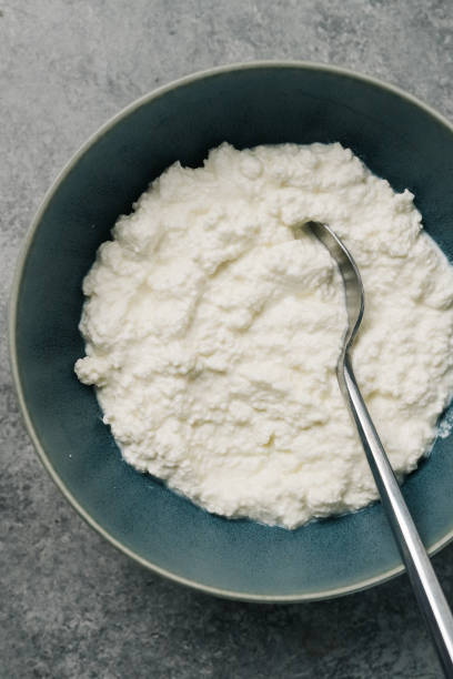 istock Overhead bowl of ricotta cheese and spoon 1316302221
