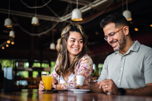 istock Happy couple chatting in a cafe 1316302311