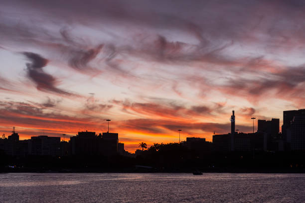 istock Beautiful sunset view to orange clouds over downtown buildings 1316303319
