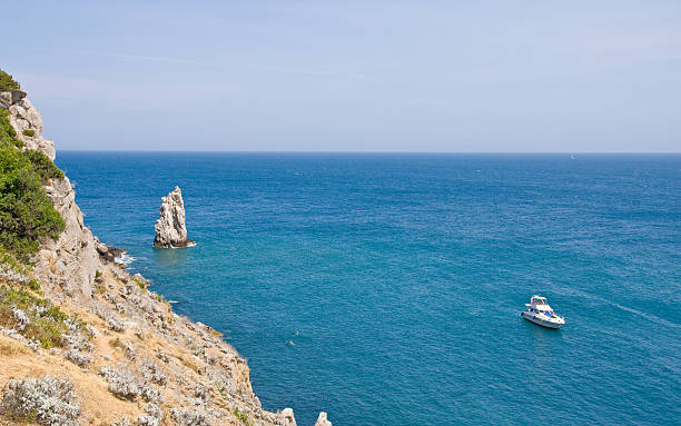 istock marine bay with rocks and cutter 131630346