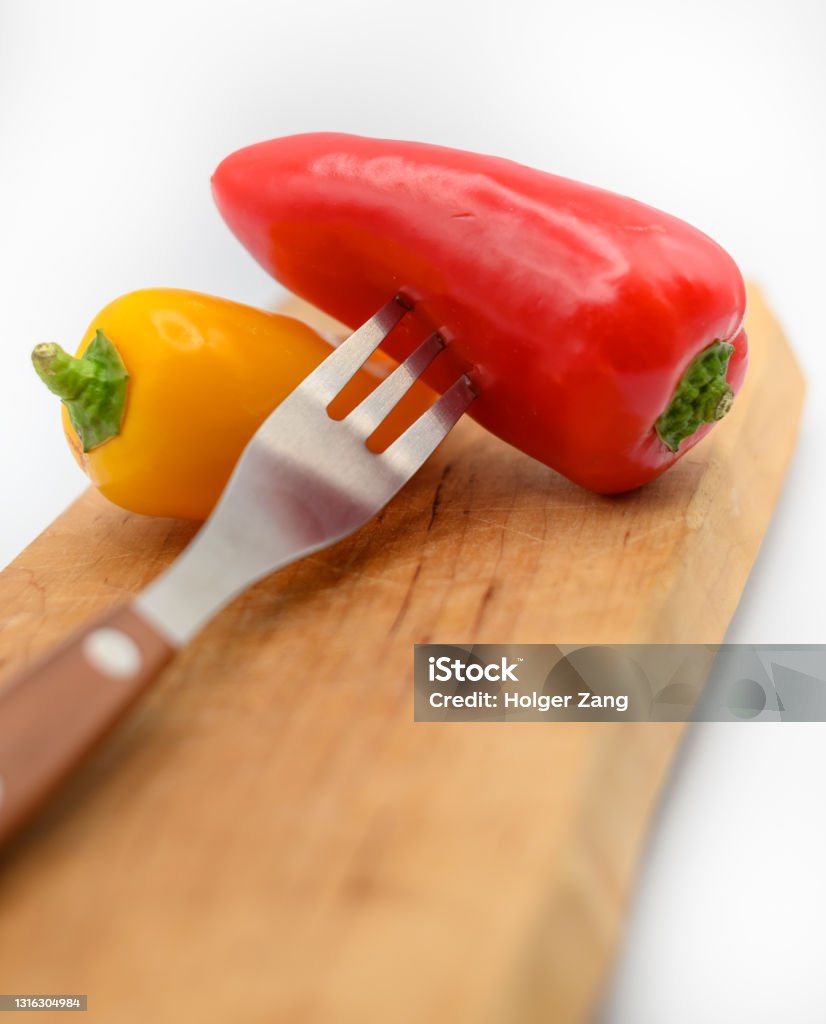 Sliced pepper Makro of sliced peppers with different kitchen items Bell Pepper Stock Photo
