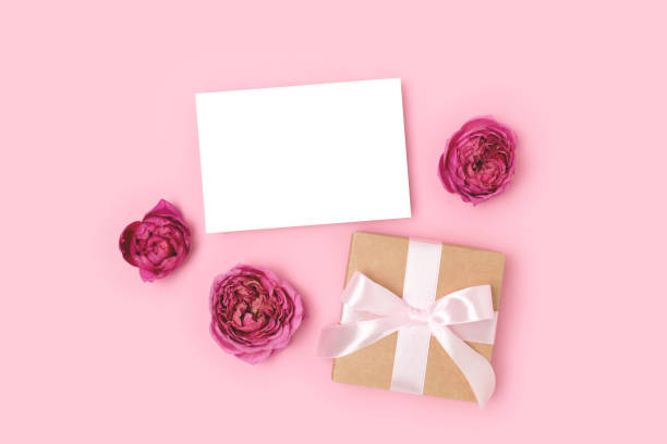 istock Greeting card mockup, gift box and rose flowers. 1316306087