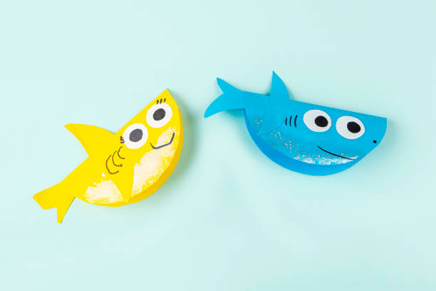 istock DIY and kids creativity. Making shark from paper. Children Craft workshop 1316306648