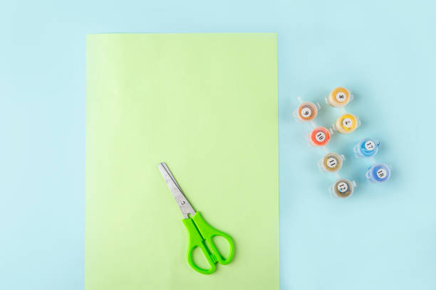 istock DIY and kids creativity. Step by step instruction: how to make origami paper butterfly. Step 1 preparation tools colored paper, scissors, paints. Children Craft workshop. 1316306695