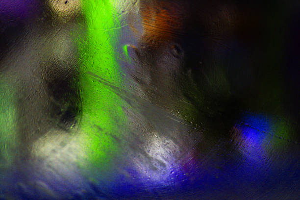 istock colorful texture created by rain and street lights on glass. 1316307599