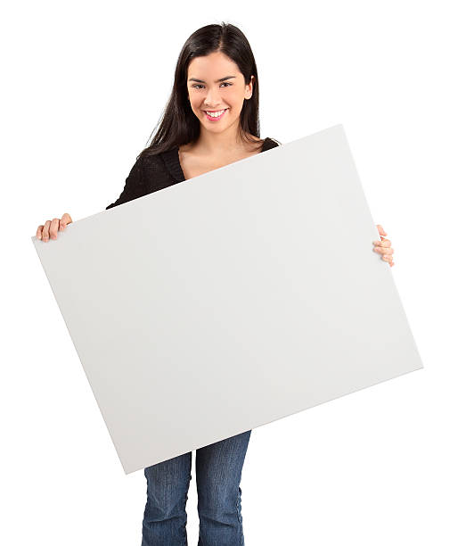 istock Young Woman Holding a Blank White Sign 131630910