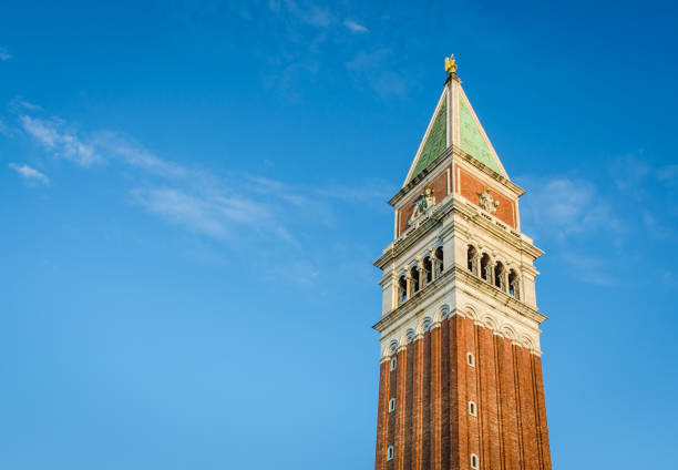 The spire of the Campanile or St. Mark's Tower on St. Mark's Square in Venice in landscape format.