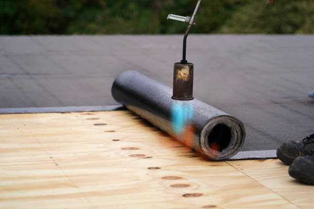 bitumen roofing.  a with a gas burner and a roll of tar paper. flat roof installation. - bitumen felt imagens e fotografias de stock