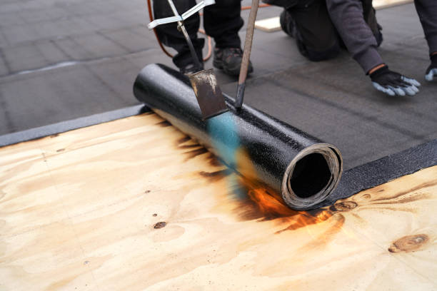 bitumen roofing.  a with a gas burner and a roll of tar paper. flat roof installation. - bitumen felt imagens e fotografias de stock