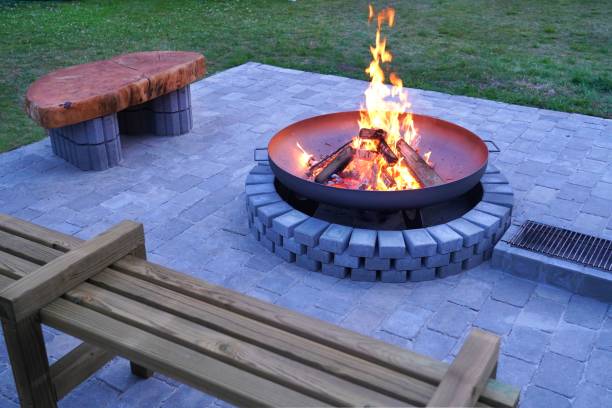 istock Iron fire pit and burning fire in fire place  a garden . 1316311259