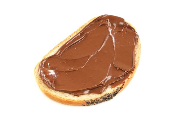 istock Chocolate nougat cream spread on a bread slice. 1316311766