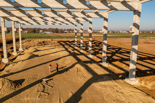Construction Workers Standing Under Frame Structure Stock Photo ...