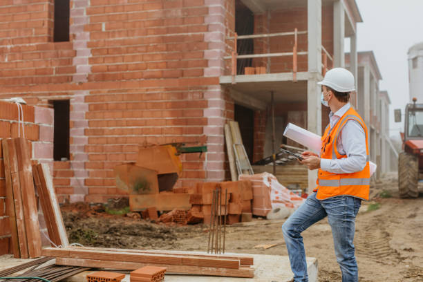 istock Male architect wearing protective face mask and working at construction site 1316313319