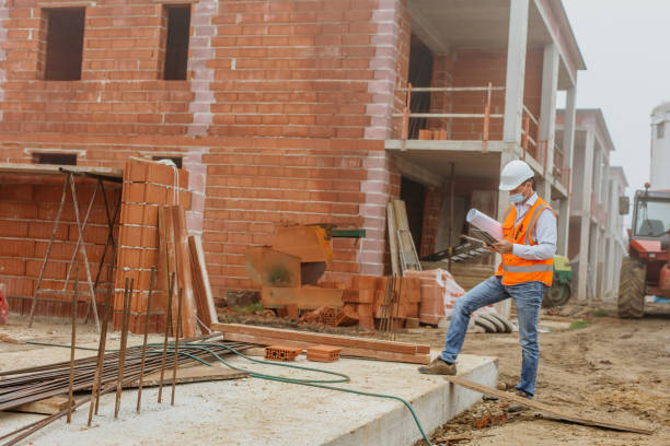 istock Male architect wearing protective face mask and using digital tablet at construction site 1316313359