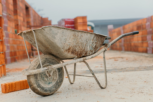 Wheelbarrow cement cart at construction site