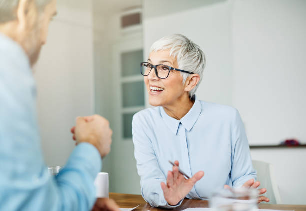 istock business office person discussion document papers teamwork senior meeting 1316314789