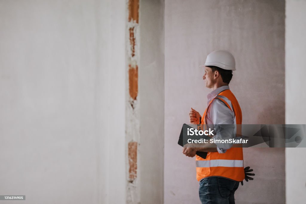 Incomplete Building Work Architect Evaluating Work At Under Construction Site Stock Photo ...