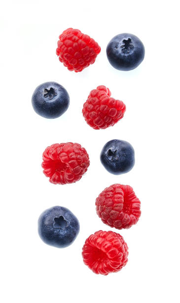 istock Sweet raspberries with blueberries on white backgrounds. 1316315096