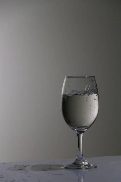 istock Glass cup filled with bubbly water, with white background 1316317898