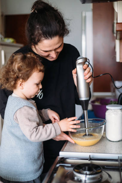 istock Mom and son making cake for mothers day 1316320026