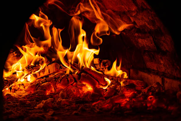 istock fire in the oven. Firewood is enveloped in flames 1316320042