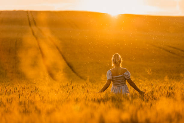 istock Woman admiring view from wheat field 1316320111