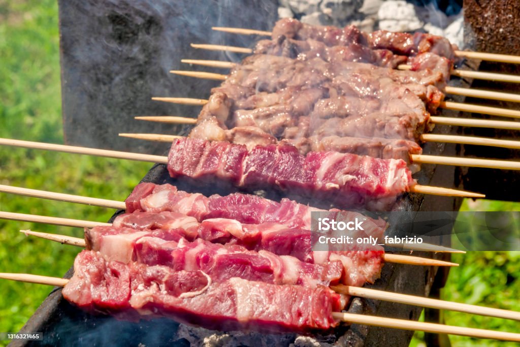 Arrosticini - Wikipedia Arrosticini, traditional meat shish kebab from Abruzzo ,Italy Abruzzo Stock Photo