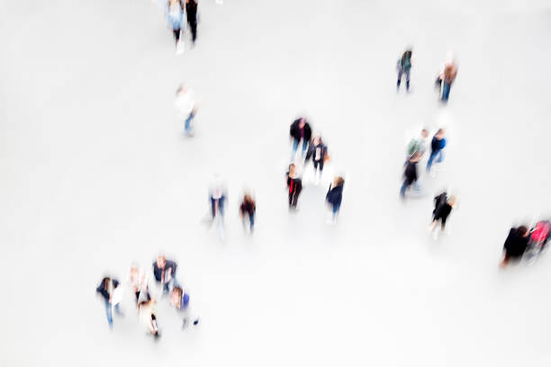 istock Group of People Walking, Elevated View, Motion Blur Effect 1316324379