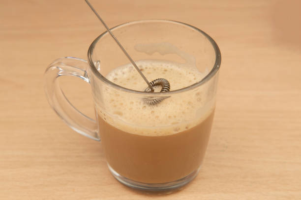 istock Making cappuccino coffee with a mixer 1316325502