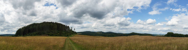 istock Panorama of eifel landscape with Nerother mountain and fields over cloudy sky ,Germany, Neroth 1316331626