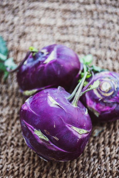Purple Kohlrabi 3d rendering with realistic texture on the wooden table