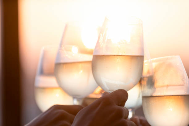 istock Group of friends having fun and toasting outdoors with white wine 1316334232