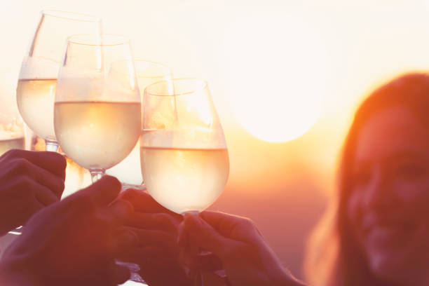 istock Group of friends having fun and toasting outdoors with white wine 1316334242