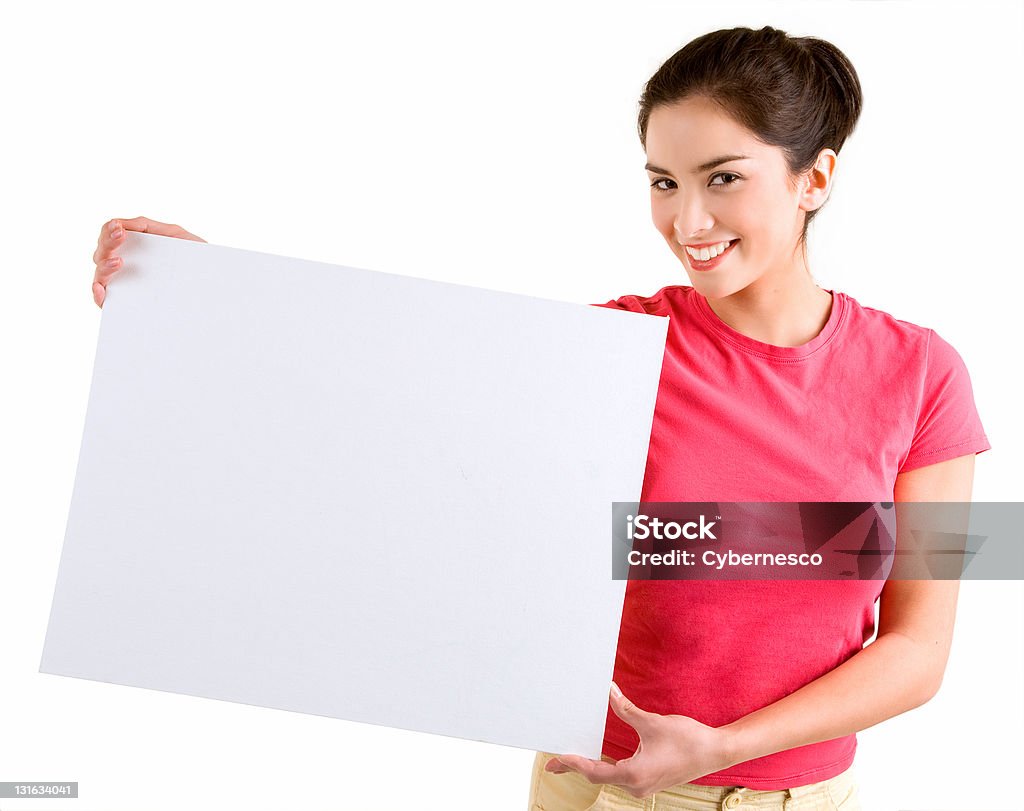 Girl Holding a Blank White Sign A beautiful young girl is holding a blank white sign. Adult Stock Photo