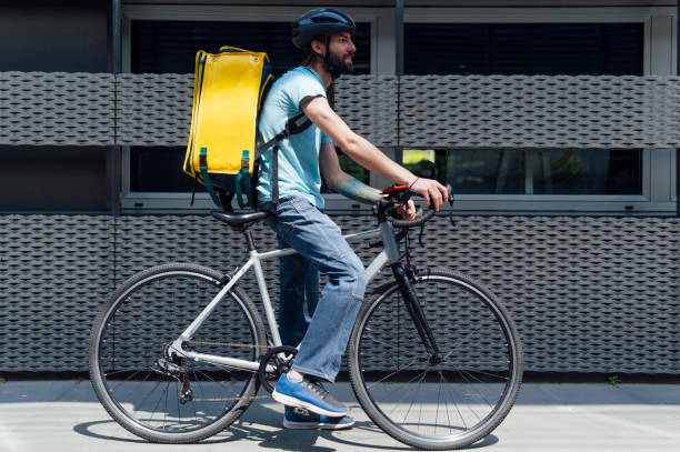 istock young delivery man with yellow backpack takeaway concept 1316340937