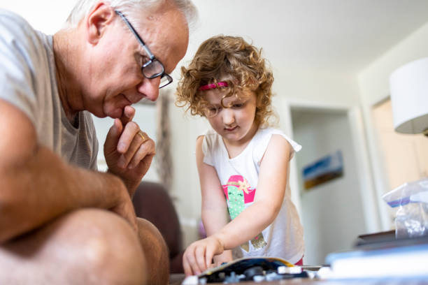 istock Grandpa playing with granddaughter 1316343403