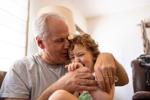 Grandpa playing with his granddaughter