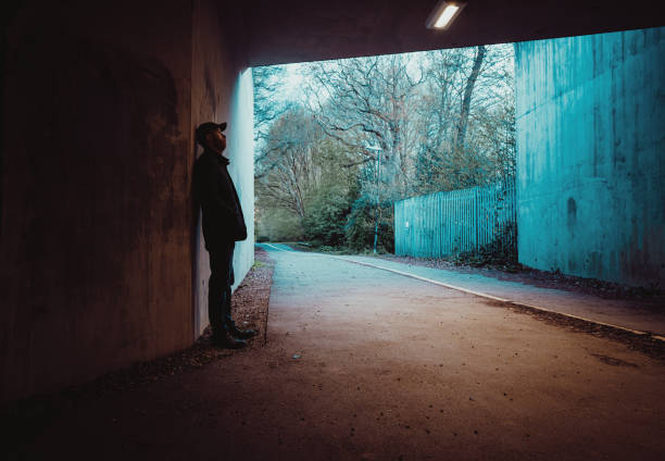 istock Lonely man alone in urban tunnel 1316345635