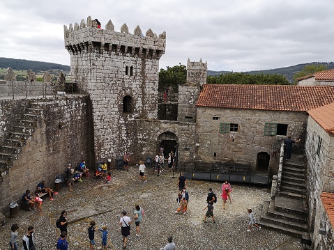 August 9, 2020 - Vimianzo, Spain: Tourists in Vimianzo Castle that was built in the 12th century and it was the property of the Moscoso family. In 1467 it was conquered and destroyed by the Irmandinos, but later it was rebuilt under Archibishop Fonseca. Galicia, Spain