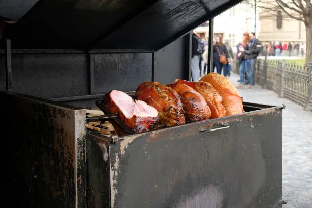 Photo of Roasted pork ham shop on Prague city center,street food preparation