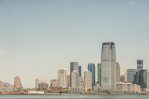 Jersey City panoramic view. Manhattan over the Hudson river with famous Freedom tower remote view.