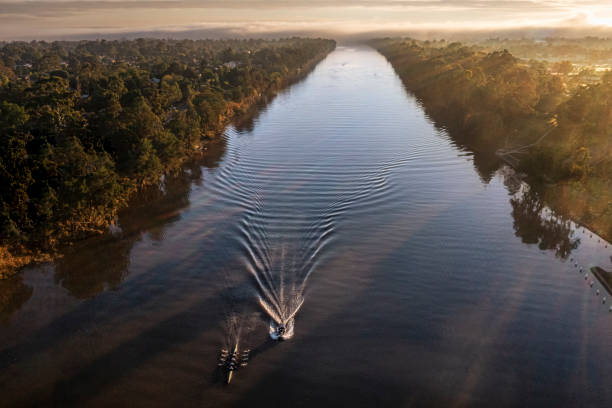 Aerial view of the Nepean River, Penrith NSW, Australia, at dawn with fog and a rowing team