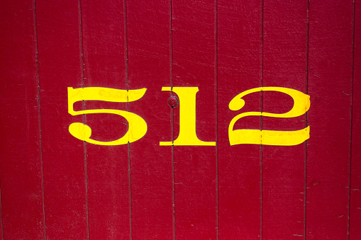 Number 512 on Vibrant Red Background. Copy space available.