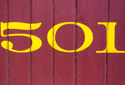 Number 501 on Vibrant Red Background. Copy space available.