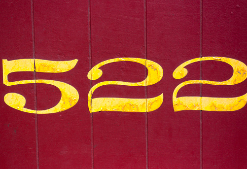 Number 522 on Vibrant Red Background. Copy space available.