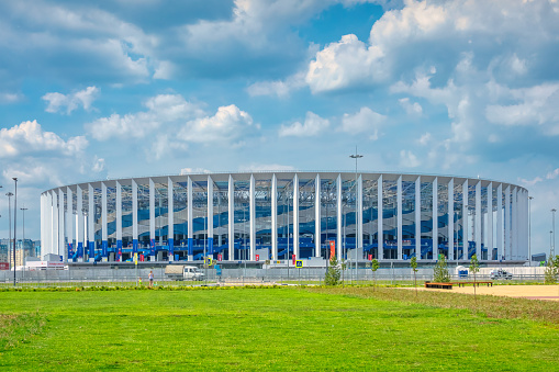 Almere, The Netherlands, July 6, 2022: remarkable, dome-shaped office building with shiny facade in a green environment