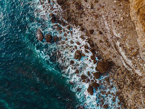 Drone View of Waves Crashing on the Rocks of the Algarve Cliffs, Portugal