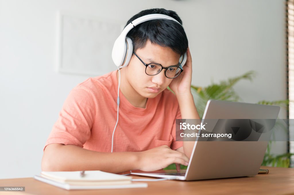 Man Computer Learing Asian Student Man Learning Online Using A Computer Laptop With ...