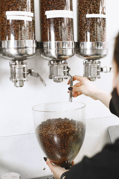 istock Coffee is poured into beans in glass containers 1316365644