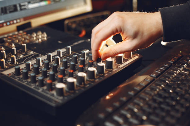 istock Man working in a studio with a sound recording equipment 1316366655